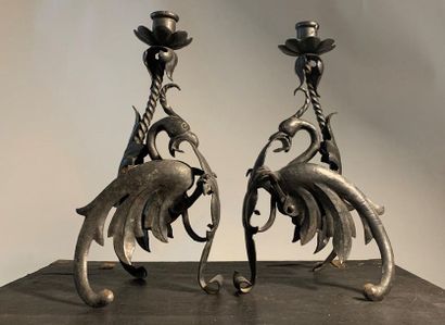 null Pair of wrought iron candleholders with phoenix decoration. 1880. 

Height 32...