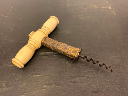 null Corkscrew with an ivory handle and a part of a wrought iron set carved and gilded...