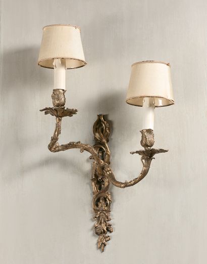 null SUITE OF FOUR LIGHTINGS with two asymmetrical leafy light arms, Louis XV style....