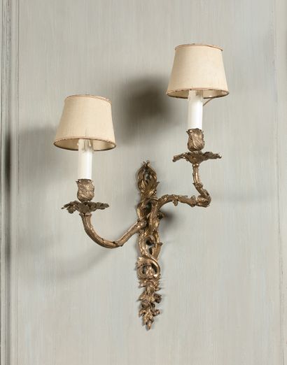 null SUITE OF FOUR LIGHTINGS with two asymmetrical leafy light arms, Louis XV style....