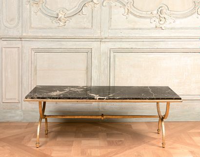 Low table with golden wrought iron X-shaped...