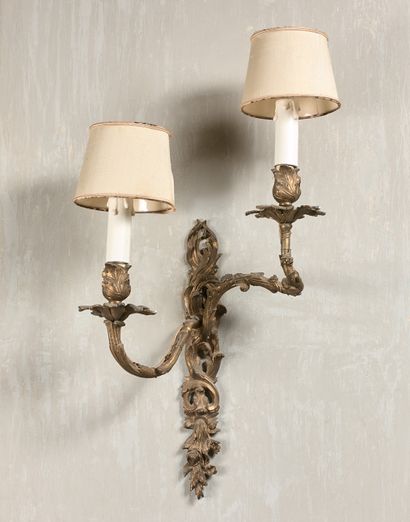 null SUITE OF FOUR LIGHTINGS with two asymmetrical leafy light arms, Louis XV style....