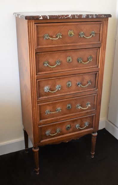 null A five drawer walnut chest of drawers with a veined marble top, Louis XVI style....