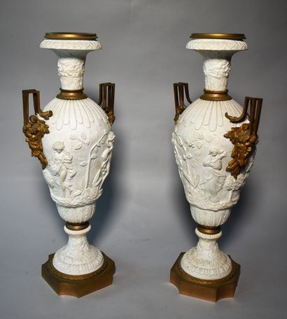 null Pair of biscuit vases with allegorical decoration in relief of the four seasons,...
