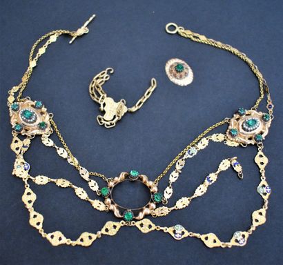 null Gold slave necklace with three oval medallions decorated with green stones....