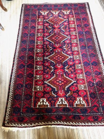 null 
LOT OF FOUR RUGS Orient : One with blue background, red center and spandrels,...
