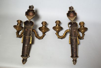 null Pair of two-light gilt bronze sconces, fluted shaft with garlands, topped by...