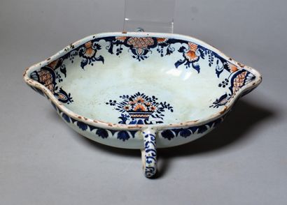 null Oblong earthenware SAUCIERE with two handles decorated like Rouen. 19th century....