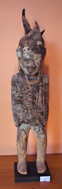  SCULPTURE of a character in wood and vegetable...