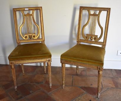 null Pair of lyre back chairs in molded and gilded wood. 18th century. Height 88...