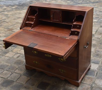 null Mahogany sloping desk, opening with four rows of drawers and a flap. Wrought...