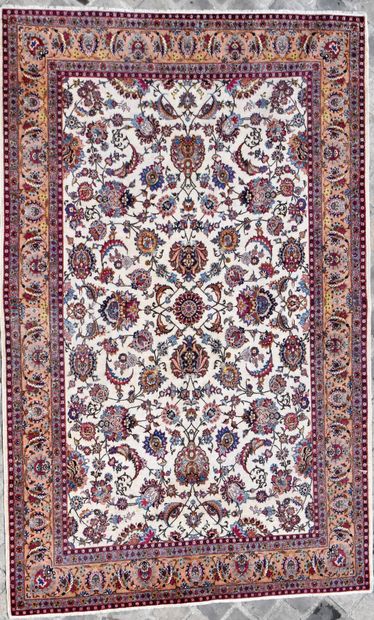 null Persian carpet with white background and floral decoration, brick border with...