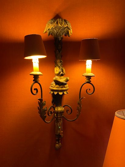 null A PAIR OF GOLDEN WOOD SConces with two lights decorated with an African musician...