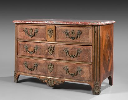 Walnut veneered chest of drawers with a slightly...