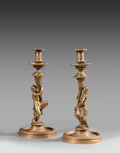 A pair of chased and gilt bronze torches,...