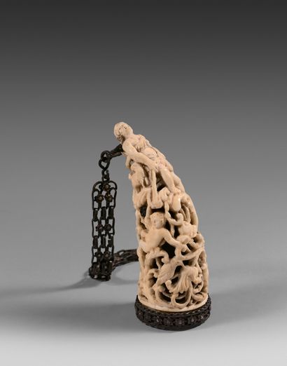 A small carved and openwork ivory snuffer...