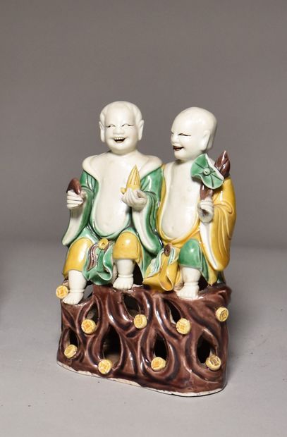 null CHINA, 20th century: Sancai enamelled biscuit GROUP, representing the Hoho brothers...