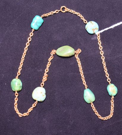 null NECKLACE in 18K (750) gold with forçat links interspersed with rough turquoise....