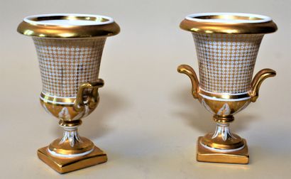 null PAIR OF MEDICIS VASES in white and gold porcelain in the Empire style. Marked....