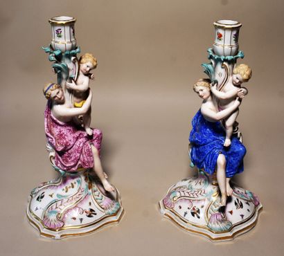 null SAXONY: TWO polychrome porcelain candlesticks decorated with a woman and a child...