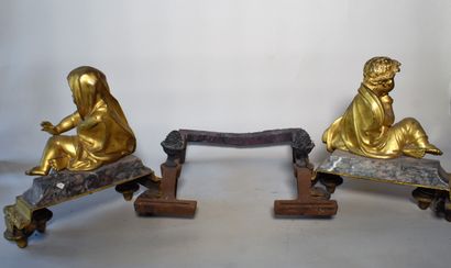 null Pair of ormolu and griotte marble CHENETS with children warming themselves....