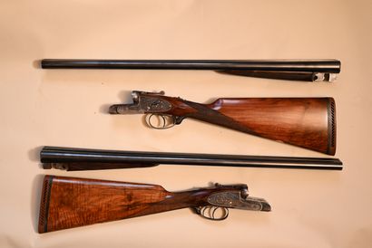 
PAIR OF GUNS with engraved locks of rinceaux,...