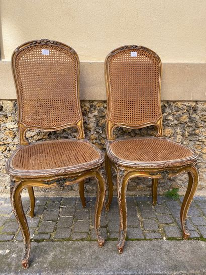 TWO CHAIRS in carved and gilded wood with...