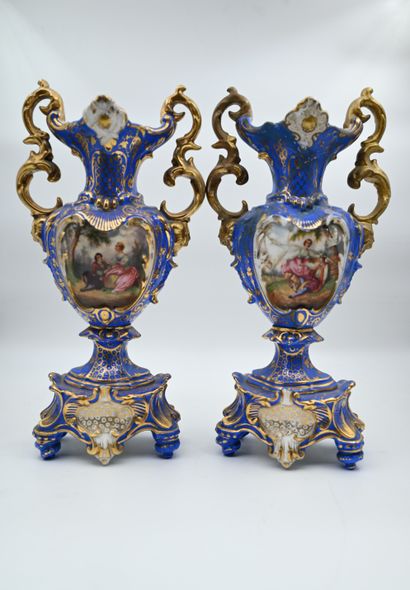 null PAIR OF GOLDEN PORCELAIN VASES on a blue background, scrolls decoration on one...