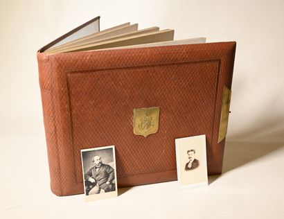 null PHOTO ALBUM in squared leather, golden clasps, and its content of photo-cards....