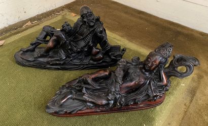 null CHINE, XXe siècle : DEUX SUJETS en bois sculpté figurant un homme et une femme...