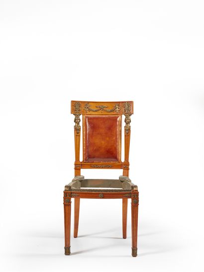 null Stained wood chair with curved banded backrest with rich bronze ornamentation...