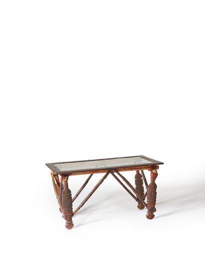 Table composed of a camel saddle transformed...