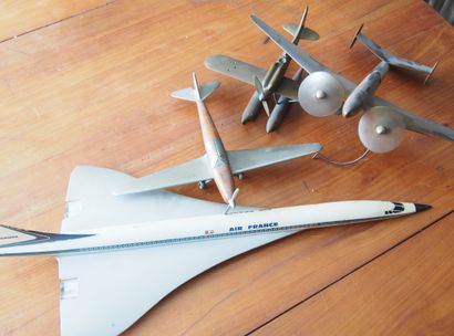 null LOT: four model airplanes in wood, metal or plastic.