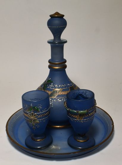 null Water service in opaline blue background with polychrome and gold enamel decoration...
