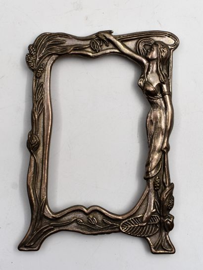 null White metal photographic frame with woman decoration, circa 1900. Height: 14...