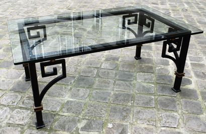 null Wrought-iron low table with Greek decoration, gilded attachments. Glass slab....