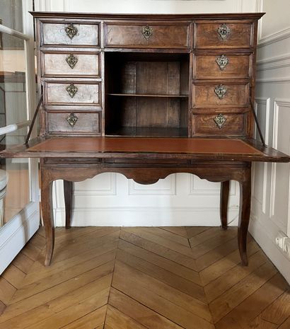 null SECRETARY opening with nine drawers and a pigeonhole concealed by a flap and...