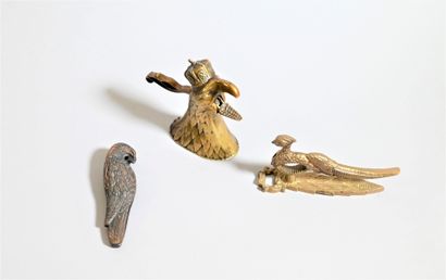 null Three bronze nutcrackers featuring an imperial eagle, a crested bird and a parakeet....