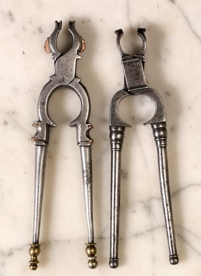 null Two wrought-iron nutcrackers. Pincer models with
with forked handles. The jaw...