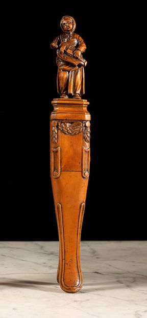 null Nutcracker. Boxwood pincer model carved with a standing hurdy-gurdy player on...