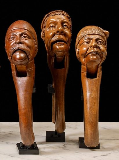 null Three nutcrackers in patinated wood. Pincer models depicting men's heads wearing...