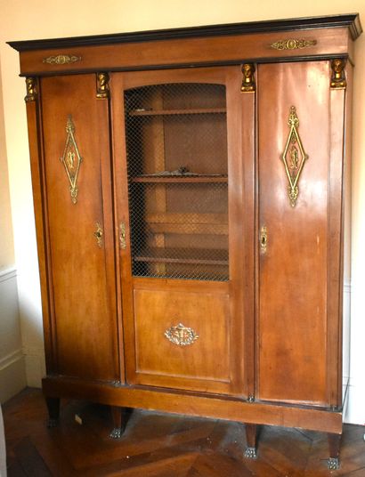 null Three-door mahogany LIBRARY with bronze ornaments (accidents and missing parts)....