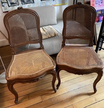 null PAIR OF CHAIRS in molded and carved natural wood, caned seats and backs (accidents),...