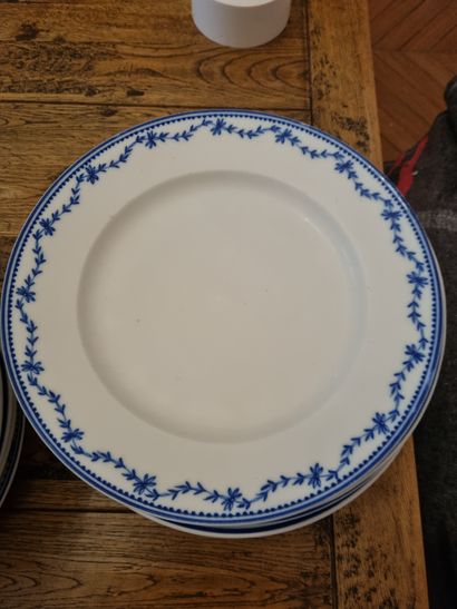 null A white earthenware dinner service with blue garlands (three different designs,...