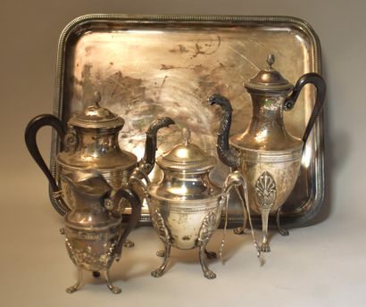null A silver tea and coffee service on four feet decorated with rais-de-cœurs, palmettes,...