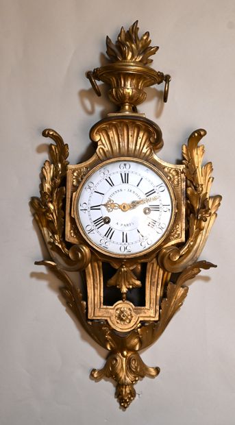 null Gilt bronze wall-mounted clock with foliage and foliate decoration, topped by...