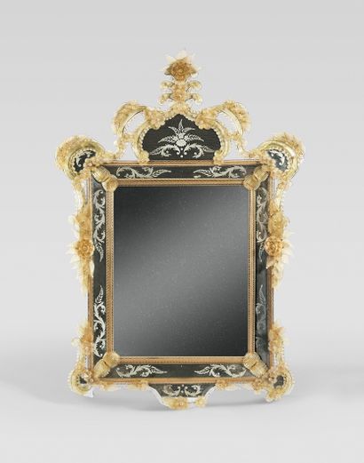 null MIRROR with double frame engraved with foliate scrolls and pediment decorated...