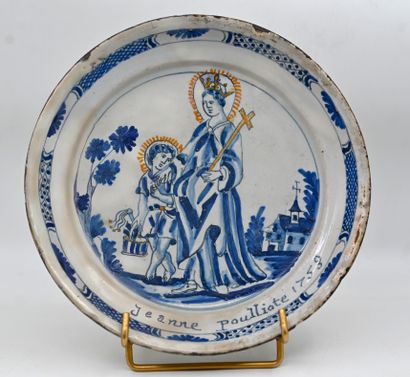 null * SINGLE earthenware plate depicting Sainte Jeanne in blue monochrome and inscribed...