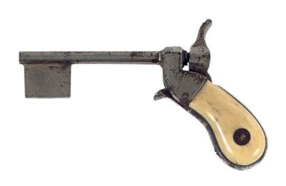 null Clef pistolet miniature en acier avec crosse à flasques en ivoire. XIXe siècle....
