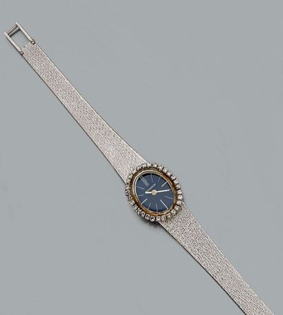 null Montre bracelet de dame en or gris 18 ct (750) à boîtier ovale serti de diamants...